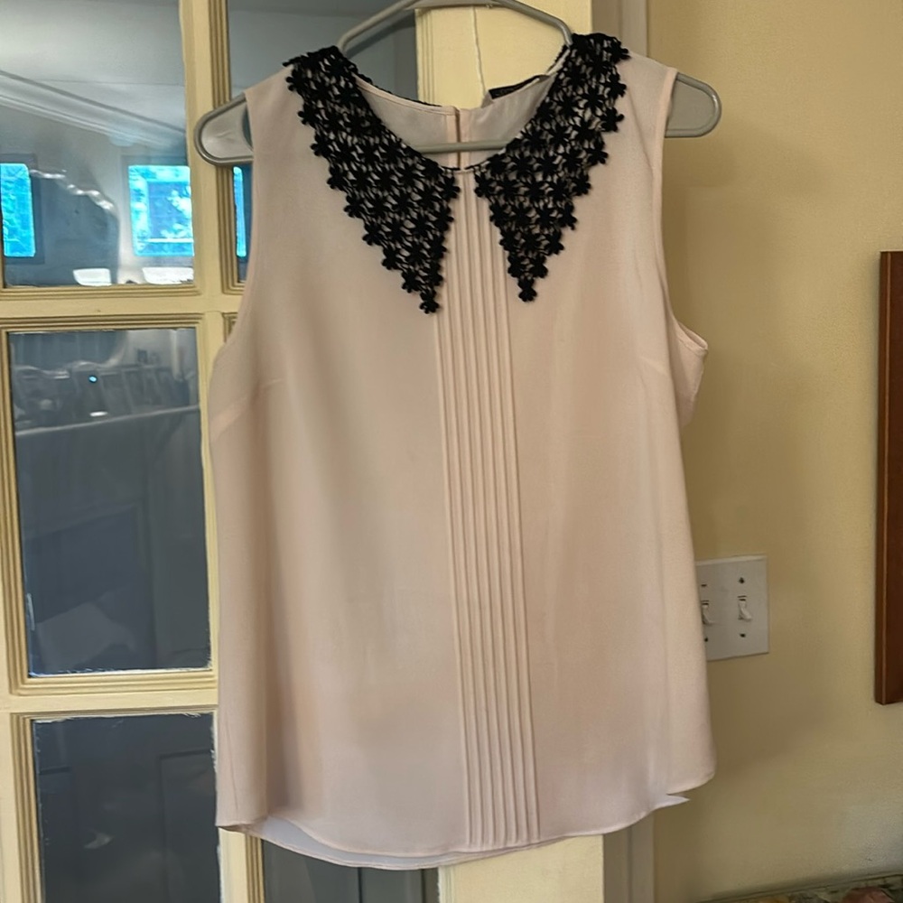 Beautiful top from Anthropologie with black lace collar